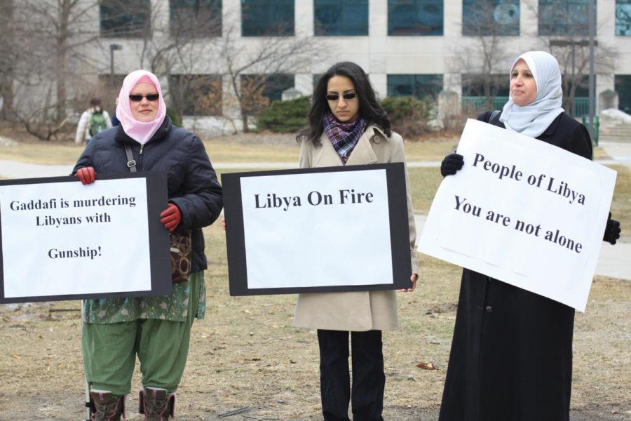 Aermin Sabiy, graduate student, Dalia Abo Sheasha, senior in software engineering, and Emily Hull, graduate in chemistry, protest in front of Parks Library on Tuesday, Feb.22. 
