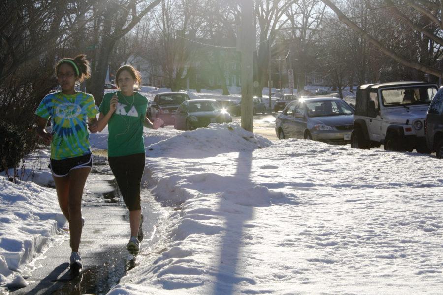 Katie Henry, left, sophomore in journalism and mass communication, and Katelyn Barker, freshman in pre-journalism and mass communication, take advantage of the warmer weather and go for a jog through Sorority Circle. Temperatures are expected to be in the 50s this week.