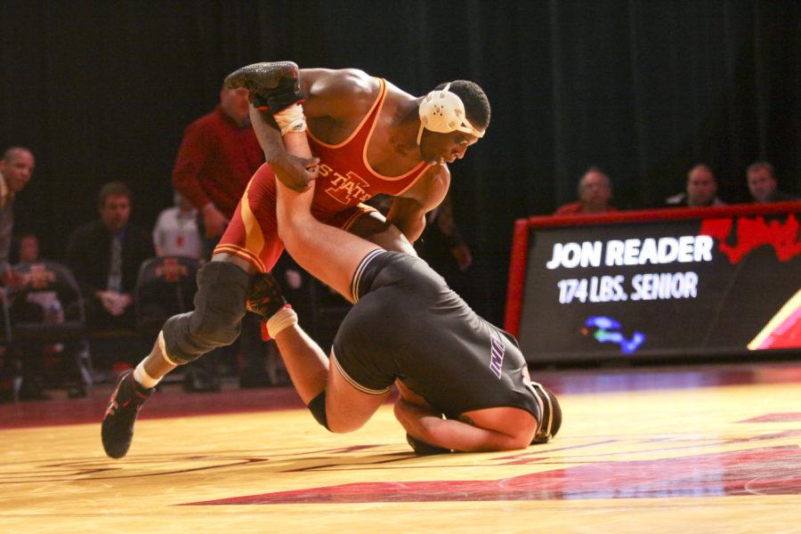 Junior Jerome Ward takes down Northern Iowas Andy OLoughlin on Friday, Feb. 4 in Hilton Coliseum. Ward won with a score of 12-3, and the Cyclones beat the Panthers with a score of 21-20.