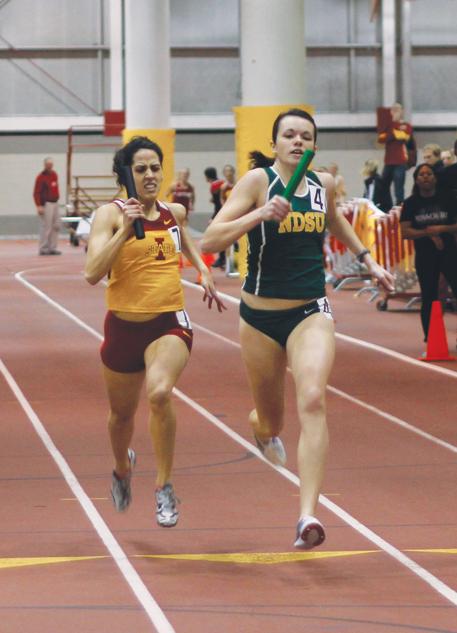 Kianna Elahi fights North Dakota States Brittany Schanandore for the finish of the 4x400-meter relay at the Bill Bergan Invitational meet Saturday at Lied Recreation Athletic Center. Elahis relay team finished with a time of 3:48.71.
