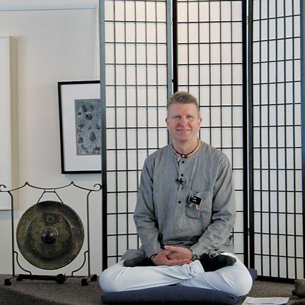 Joel Geske poses during a Sunday meditation program at the Unitarian Universalist Fellowship of Ames.