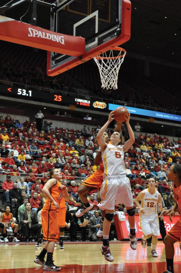 Cyclone forward Hallie Christofferson attempts to make a shot during the Iowa State versus Oklahoma State game Wednesday, Feb. 2, at Hilton Coliseum. The Cyclones defeated the Cowgirls 79-59.