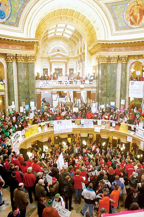 Protesters gather in the rotunda of the Wisconsin Capitol on Monday in Madison, Wis., to demonstrate their opposition to Gov. Scott Walkers proposed budget bill. Monday was the seventh day of protest in the Capitol.