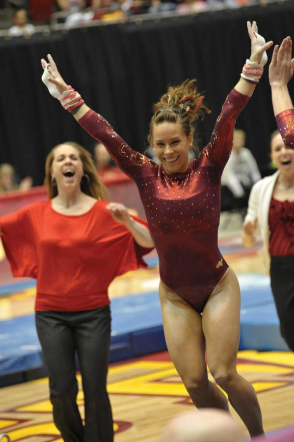 Jody+McKellar+celebrates+after+her+bars+routine+during+the+meet+against+the+University+of+Iowa+on+Friday+at+Hilton+Coliseum.+McKellar+received+a+near-perfect+9.95%2C+a+career+high+for+her+in+the+event.+The+Cyclones+defeated+the+University+of+Iowa+196.350+-+195.850+