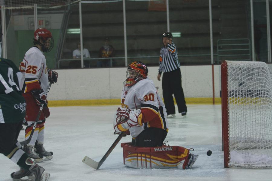 Goalie Paul Karus misses the puck Friday, Jan. 28 at the ISU/Ames Ice Arena. The Cyclones defeated the Rams 4-3 in overtime. 