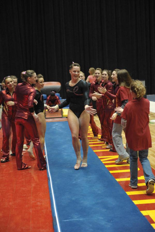 Cyclone Shea Anderson cheers with other teammates during the meet against Oklahoma on Friday, Feb 11 at Hilton Coliseum. Shea Anderson contributed 9.800 on the vault.  