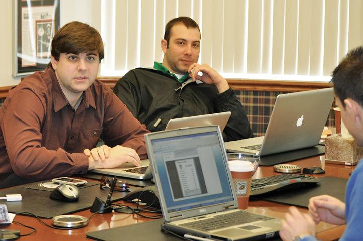 Jon Thompson and Brad Dwyer work on a new venture for Startup Weekend. 