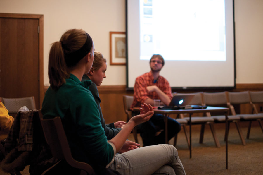 (Left) Hannah Dankbar, sophomore in political science, expresses her opinion about Chinas position in the energy industry while Christopher Schubert, senior in political science, who is also the moderator of the open forum, listens to her, Tuesday, Feb. 15, at the Gold Room of Memorial Union.