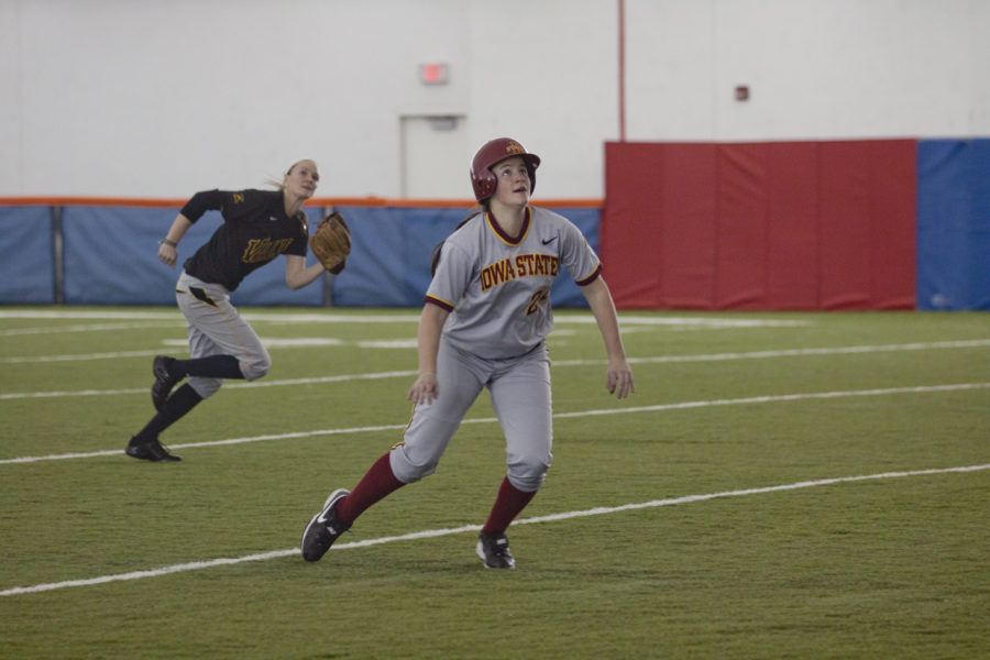 Sophomore Tori Torrescano watches for the ball while running back to first. Iowa State took on Valparaiso at the Bergstrom Indoor Training Facility on Sunday. 