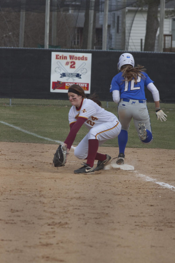 Iowa State junior Tori Torrescano digs a ball out of the dirt. Iowa State split the doubleheader with Creighton. Iowa State played Creighton on March 31 in a doubleheader at the Southwest Sports Complex in Ames, Iowa. 