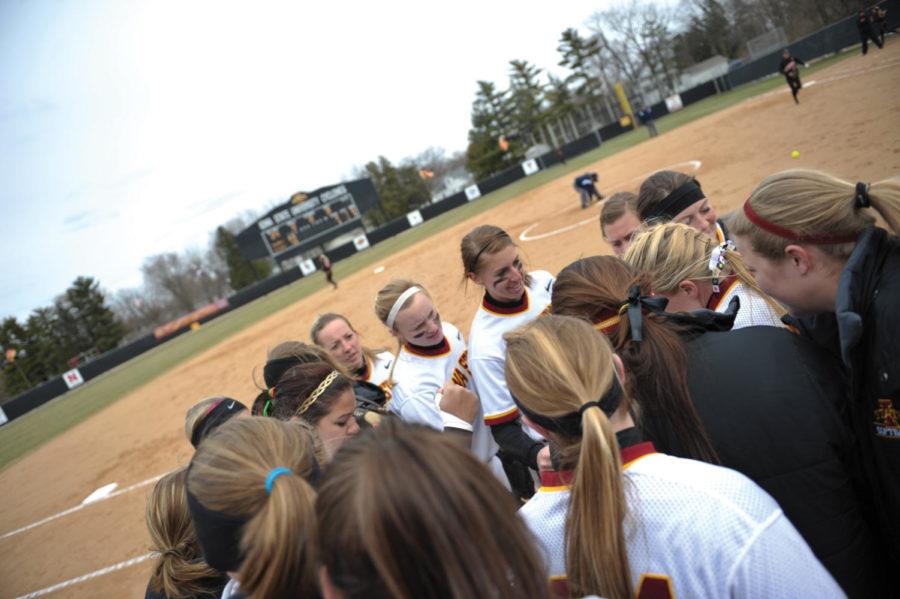 Cyclones cheer together before the softball game against Oklahoma State Saturday March 26, 2011 at the ISU Sports Complex. Photo: Zhenru Zhang/Iowa State Daily