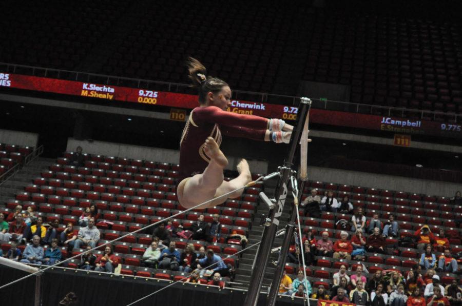 Michelle Shealy performs on the uneven bars during the match against Minnesota on Friday, March 4 at Hilton Coliseum. Michelle Shealy contributed 9.675. The Cyclones tied with Minnesota 195.325. 