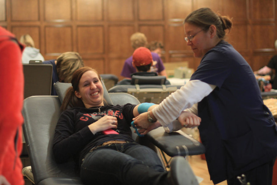 Anna Hanson, junior in communication studies donates blood on Monday, March 28 at the Great Hall of the Memorial Union. She said she would like to provide blood to everybody who needs it. 


