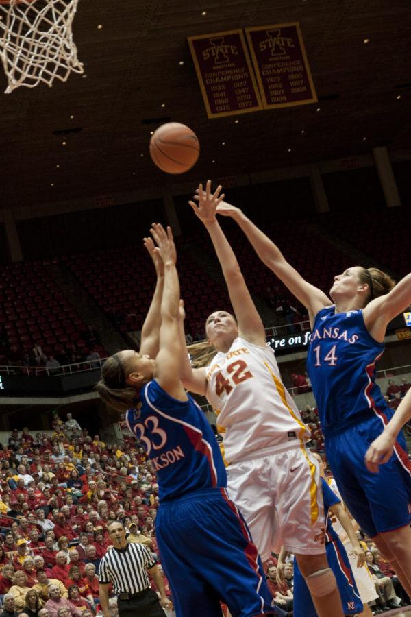 Amanda Zimmerman shoots in the paint amongst double coverage. Zimmerman posted 11 points on Tuesdays game against the Jayhawks. The Cyclones defeated the Jayhawks 72-36. 