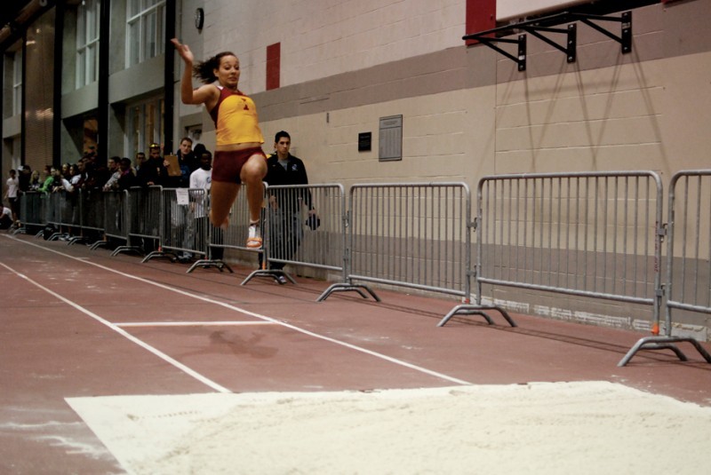Junior Jordon Andreassen competes in the womens long jump event Friday night during the Iowa State Open at Lied Recreational Athletic Center.