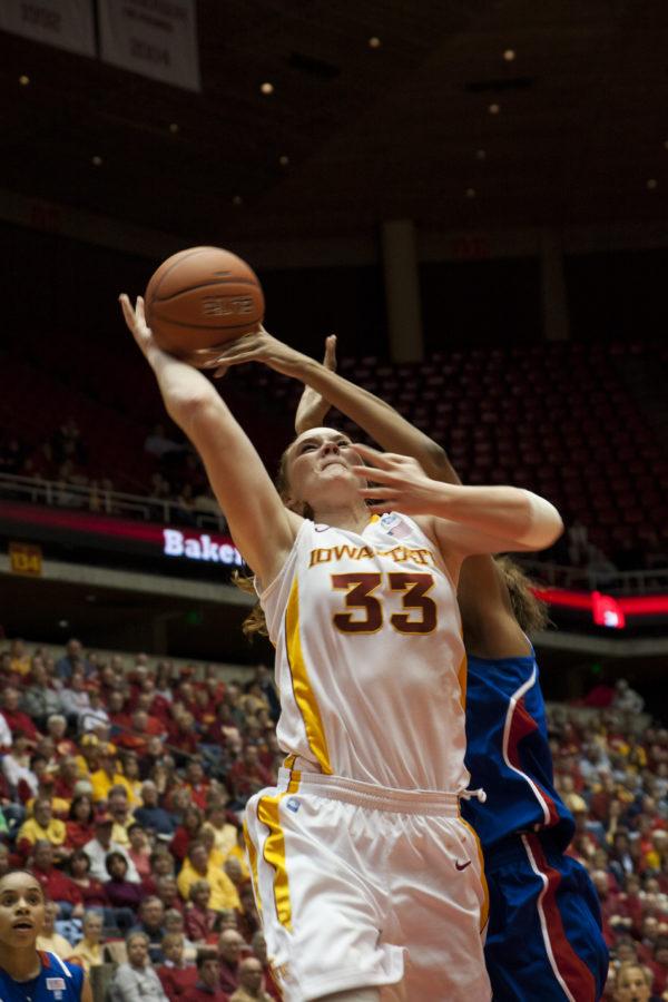 Forward Chelsea Poppens draws a foul in the first half of Iowa State's routing of Kansas, 72-36. Poppens led the team with seven rebounds and 13 points.