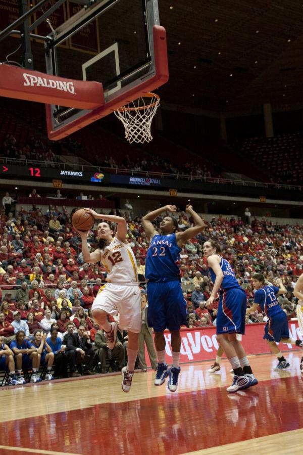 Guard Jessica Schroll puts up two in the paint early in Tuesdays games against the Jayhawks. 