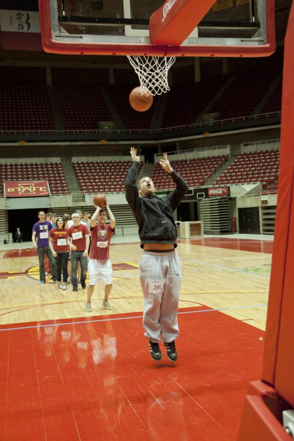 Nick Wetzel, senior in chemical engineering, shoots the ball and saves his spot in knockout. Students participated in an attempt to break the Guinness World Record for largest game of knockout Tuesday night at Hilton.