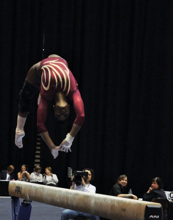 Jacquelyn Holmes performs on beam during the meet vs. Minnesota on Friday at Hilton Coliseum. Holmes contributed a 9.675 in the event. The Cyclones tied with Minnesota 195.325. 