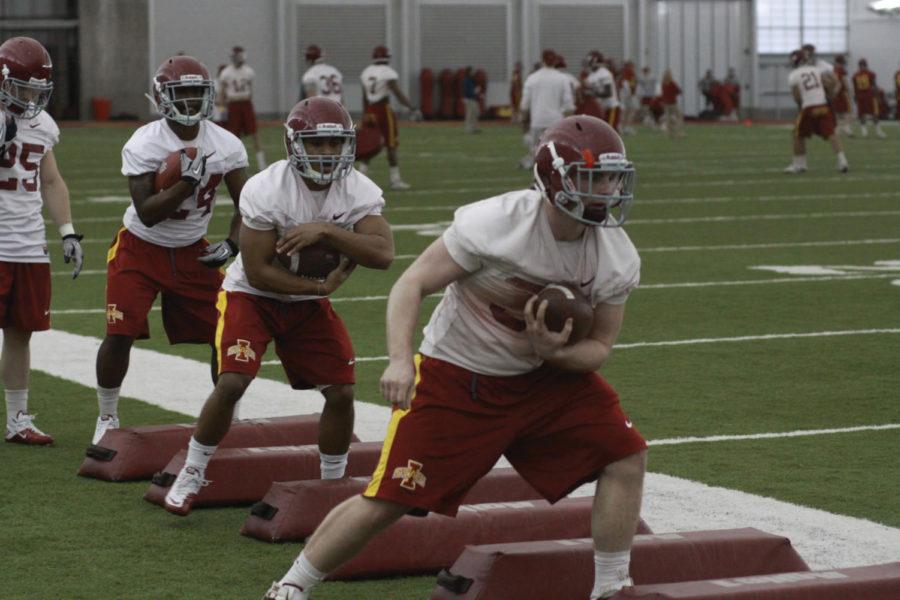 Iowa State running backs work on speed drills for the upcoming season with Jeff Woody leading. Spring football practice started March 22 at the Bergstrom Practice Facility.