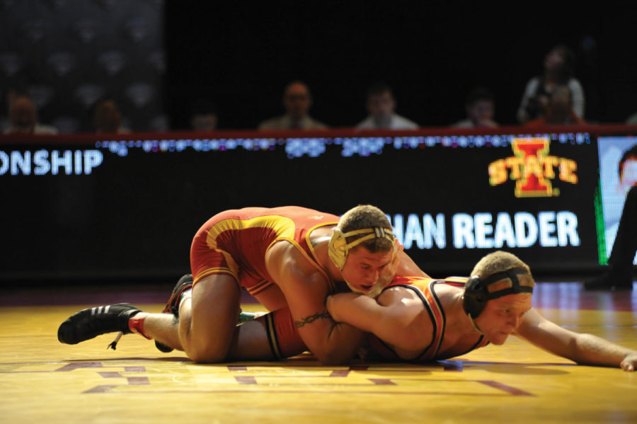 Jonathan Reader attempts take down Oklahoma State Mike Benefiel during the Big 12 Championships on Saturday, March 5 at Hilton Coliseum. 