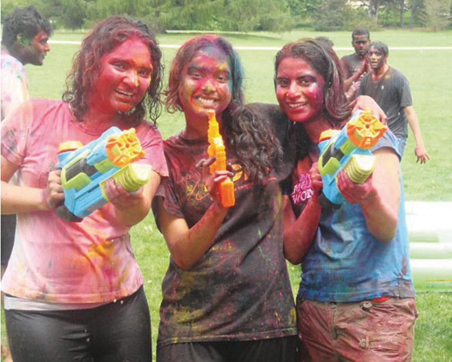 Pooja Paranjape, graduate in electrical and computer engineering, Pooja Mhapsekar, graduate in electrical and computer engineering and Asha Khokale, graduate in computer science, celebrate Holi on Central Campus last year.