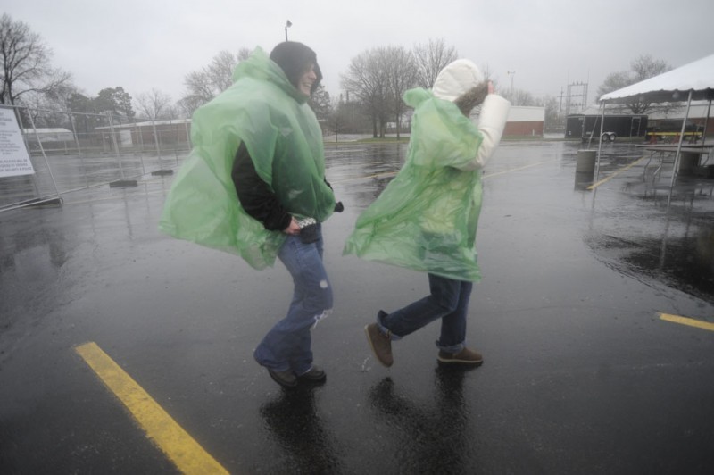 Sarah Wood, left, from Minnesota, walks away from  Live @ VEISHEA in the rain with Janelle Holsing, from Sioux Falls, S.D. Wood and Holsing came to Live @ VEISHEA for the band Love and Theft.