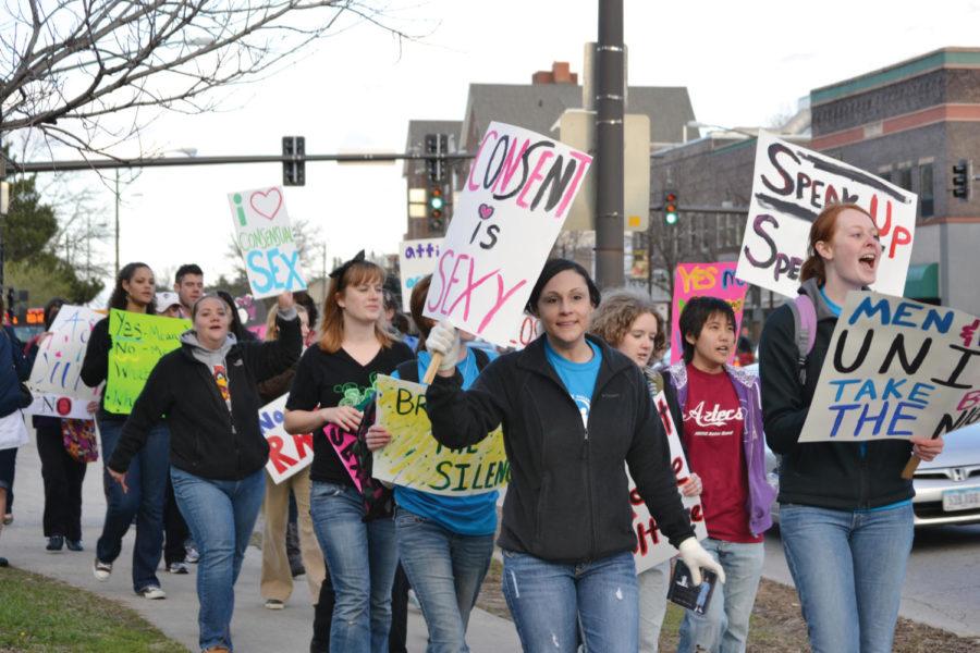 Students march for Taking Back The Night, an event to raise awareness of violence against individuals April 20 on Lincoln Way. The events purpose is to raise awareness of violence.