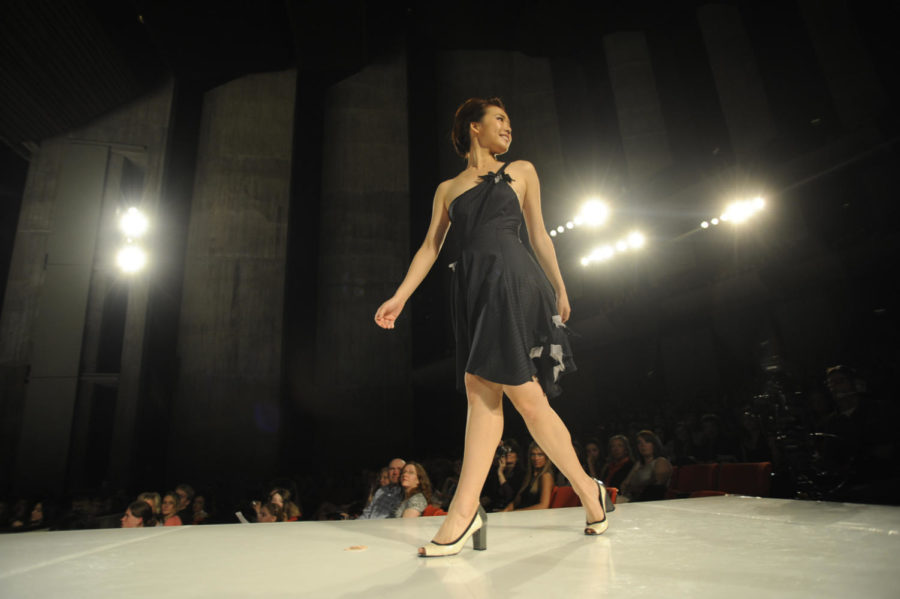 Yaxi Yang, freshman in apparel, merchandising and design, walks the runway during the 2011 ISU Fashion Show on Saturday at Stephens Auditorium.