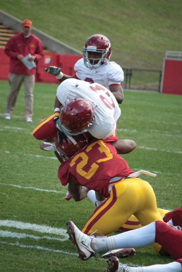 Senior Leonard Johnson makes the low tackle to stop the play during the annual Spring Game on Saturday, April 16 at Jack Trice Stadium.
