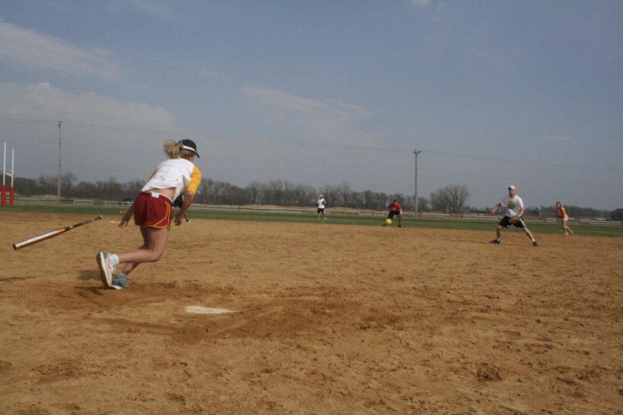 Danielle Wanfalt, freshman in agricultural education, races to first base after making contact with the ball in the third inning of the championship game for Rambo, which lost, 11-1.
