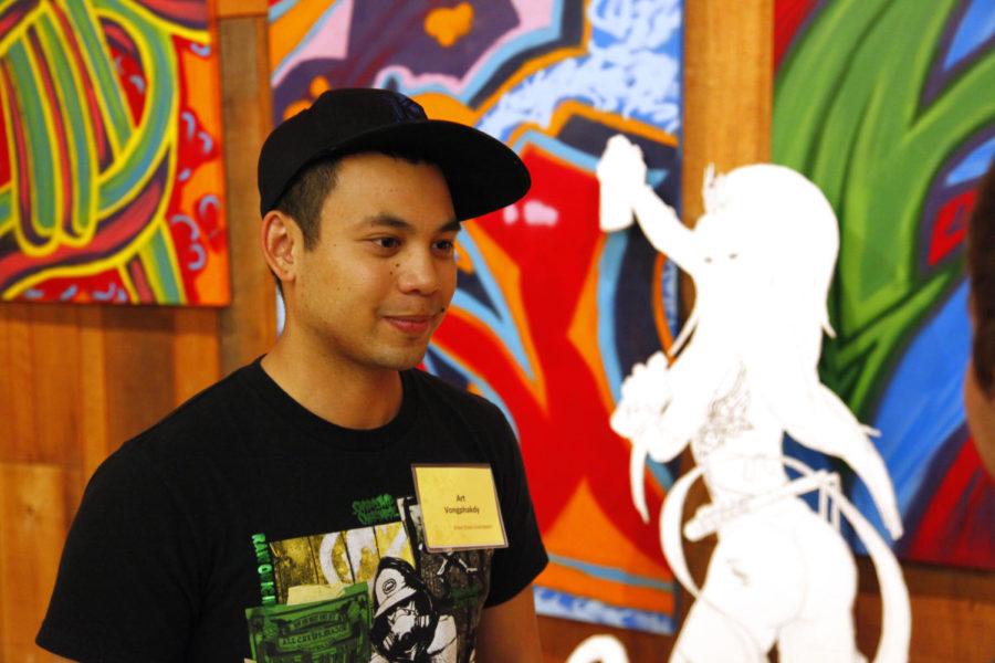 Art Vongphakdy, junior in integrated studio arts talks about his artwork. He is a graffiti artist. His work represents the final product the graffiti but also the people that make graffiti. So his work gains a three dimensionality and depth through his characters the graffiti artist, the recorder and the wheat paster.
