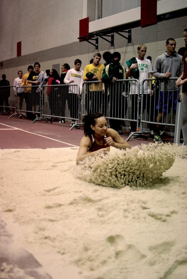 Junior Jordon Andreassen competes in the womens long jump event Friday night during the Iowa State Open at Lied Recreational Athletic Center.