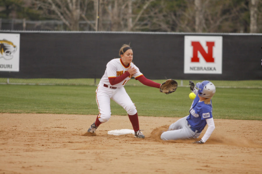 Infielder Cassie Knutson attempts to tag a Drake opponent out at second base. Drake lost to Iowa State with a score of 8-6.