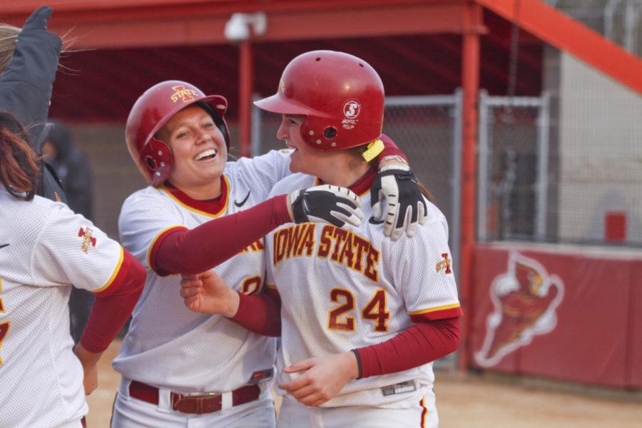 Infielder Tori Torrescano celebrates her game-winning home run with teammate Anna Cole. Torrescanos home run put the Cyclones in the lead and won the game with a score of 8-6.