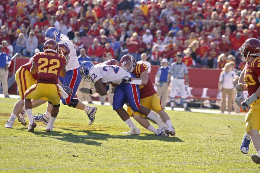Defensive end Patrick Neal fights to take down Kansas running back Angus Quigley during the game on Saturday, Oct. 30, at Jack Trice Stadium. The Cyclones defeated the Jayhawks 28-16.
