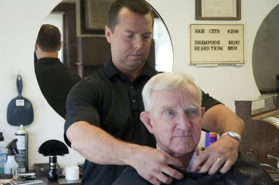 Troy Cakerice finishes up a haircut for Carroll Brekke, of Story City, on Saturday at Montys Barber Shop. Cakerice bought Monty Browns business and took over on Saturday.