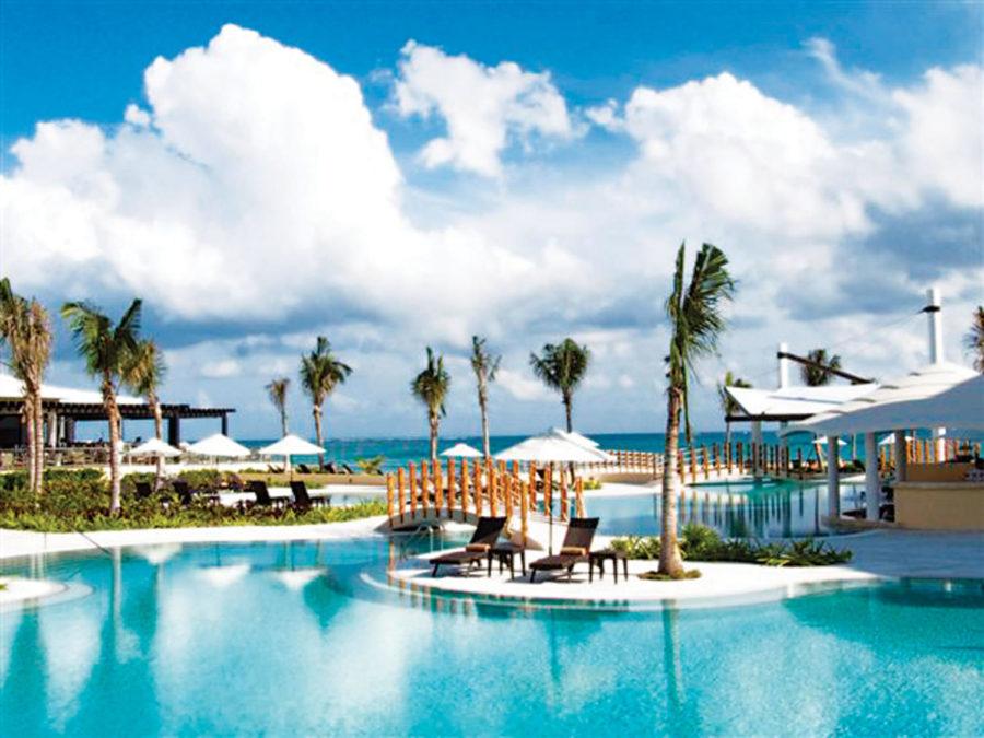 Guests at the Jade Riviera Cancun resort can swim in the main
pool, which features a swim-up bar. The resort is located in Puerto
Morelos, Mexico, about 12 miles from the Cancun International
Airport.
