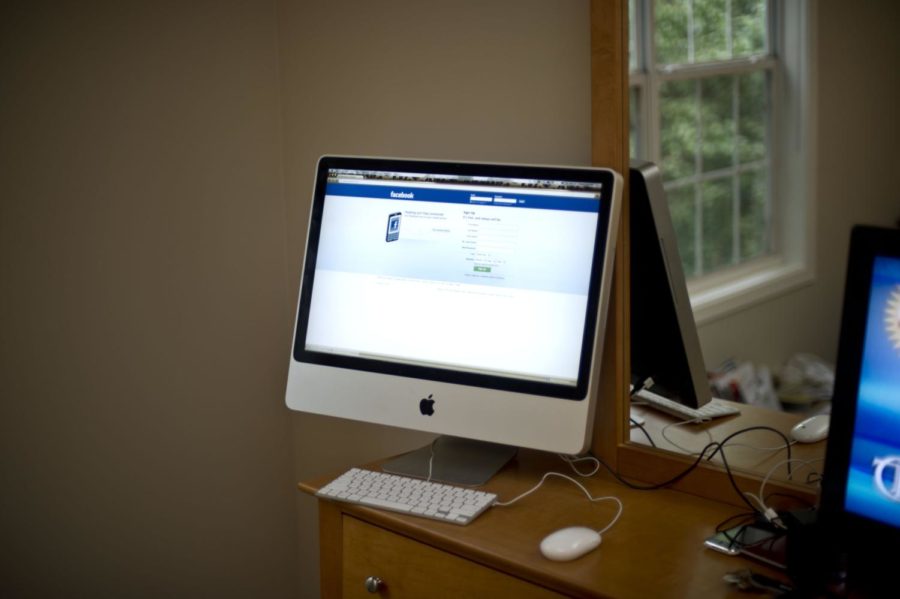 Computer with a browser window displaying Facebook.