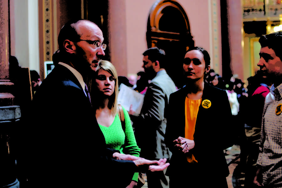 Chip+Baltimore%2C+state+representative%2C+talks+to+a+group+of+University+of+Iowa+students+about+the+budget+cuts+Monday+at+the+Iowa+State+Capitol.