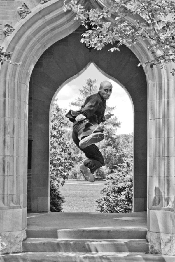 Anthony Wharton, junior in kinesiology and health, practices Kung Fu by the Campanile May 23.
 