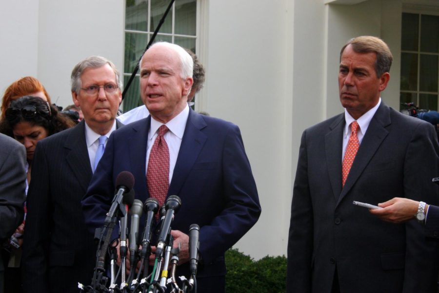 Senate Armed Services Committee ranking member John McCain addresses reporters outside the White House after a meeting with President Obama and other congressional leaders on October 6, 2009 The meeting, which took place in the state dining room, concerned the war in Afghanistan. Senate Republican leader Mitch McConnell stands behind McCain, while House Republican leader John Boehner stands beside him.