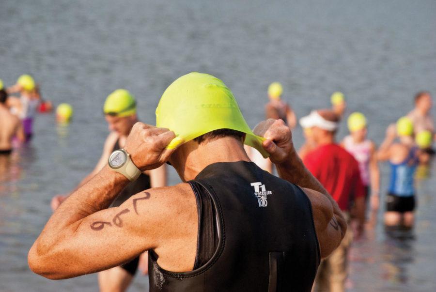 Roman Vlad, participating in the Elite competition category,
prepares for the swimming portion of the Iowa Games Triathlon on
July 10 at Easter Lake in Des Moines.
