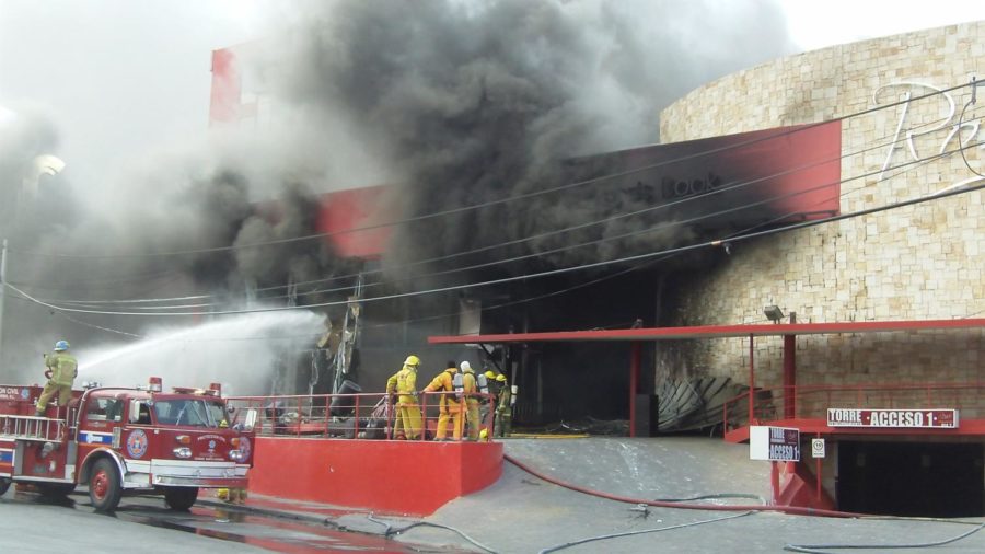 Firefighters at the scene of a grenade attack at a casino in
Monterrey, Mexico. According to local police, the incident occurred
around 4 p.m. local time at the Casino Royale when two people
aboard a vehicle arrived, and one threw three grenades into the
building. Authorities say at least 10 people were killed and 10
others were injured.
