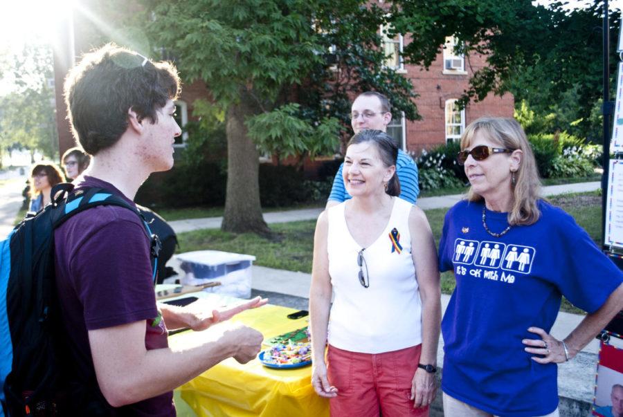 Carter Collins, freshman in genetics, talks with Pat Spangler
and Linda Trudeau at the kickoff event for LGBT on Wednesday Aug.
31. LGBTA Alliance &amp; Friends had an ice cream social and open
house.
