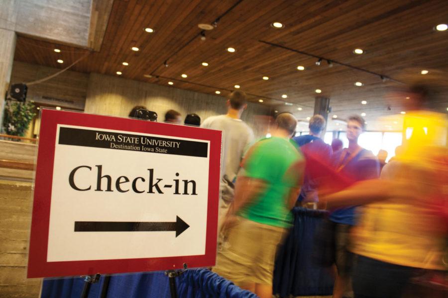 Students follow the signs through the Destination Iowa State
check-in process on Thursday, Aug. 18, 2011 inside the Scheman
Building.
