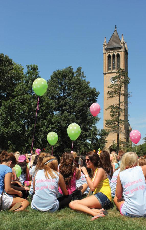 Members of Delta Zeta sorority sit on central campus on Aug. 18
flanked by the Campanile waiting to learn the affiliations of the
Rho Gammas. The day concluded with the Rho Gamma Song, a song that
incorporates portions of each houses individual songs.
