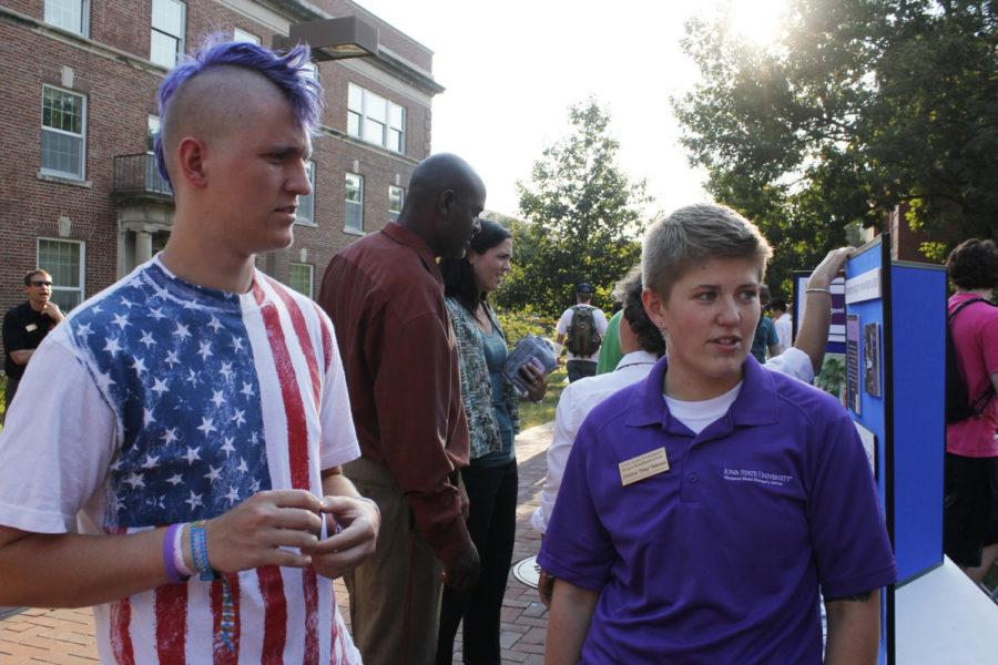 Ben Peterson, sophomore in English education and psychology,
talks with his sister, Christie Peterson, graduate student in
educational leadership and policy studies, at the LGBTA Alliance
&amp; Friends Ice Cream Social on Wednesday, Aug. 31. LGBT had a
kickoff event outside Student Services to welcome new members.
