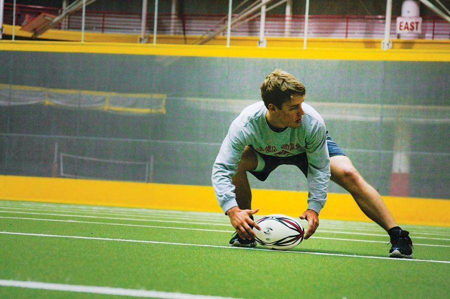 Josiah Ruhland, sophomore in pre-architecture, practices for the
Iowa State Rugby Club on Sunday at the Lied Recreation Athletic
Center. 
