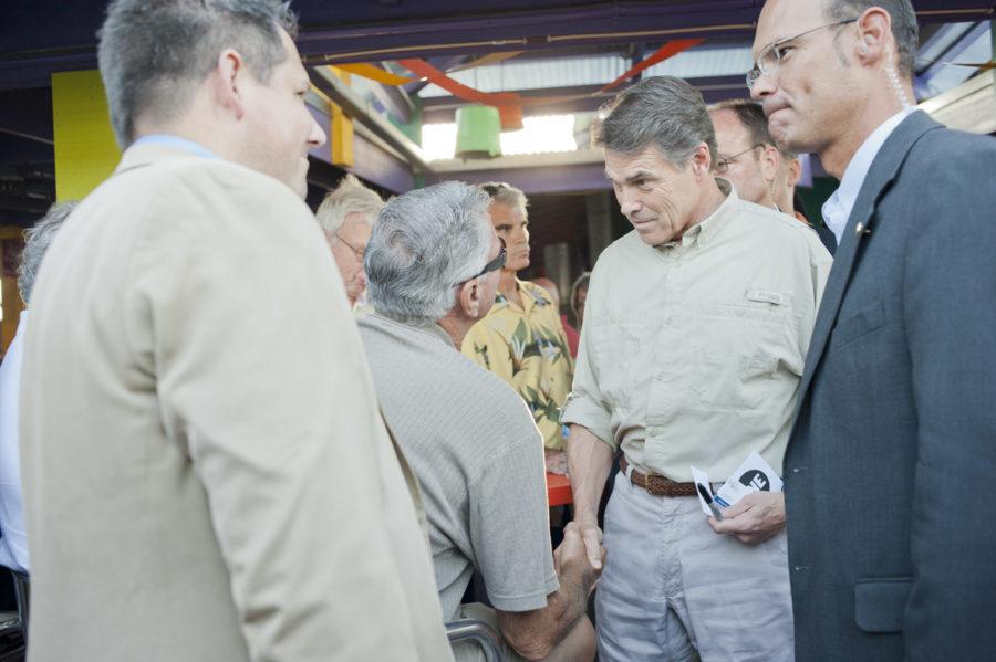 Rick Perry, Republican presidential candidate, talks to the
Iowans after the speech during the Polk County Picnic. The Polk
County Picnic is held in Jalapeno Petes at the Iowa State
Fairgrounds on Aug. 27, 2011. Photo: Yue Wu/Iowa State Daily
